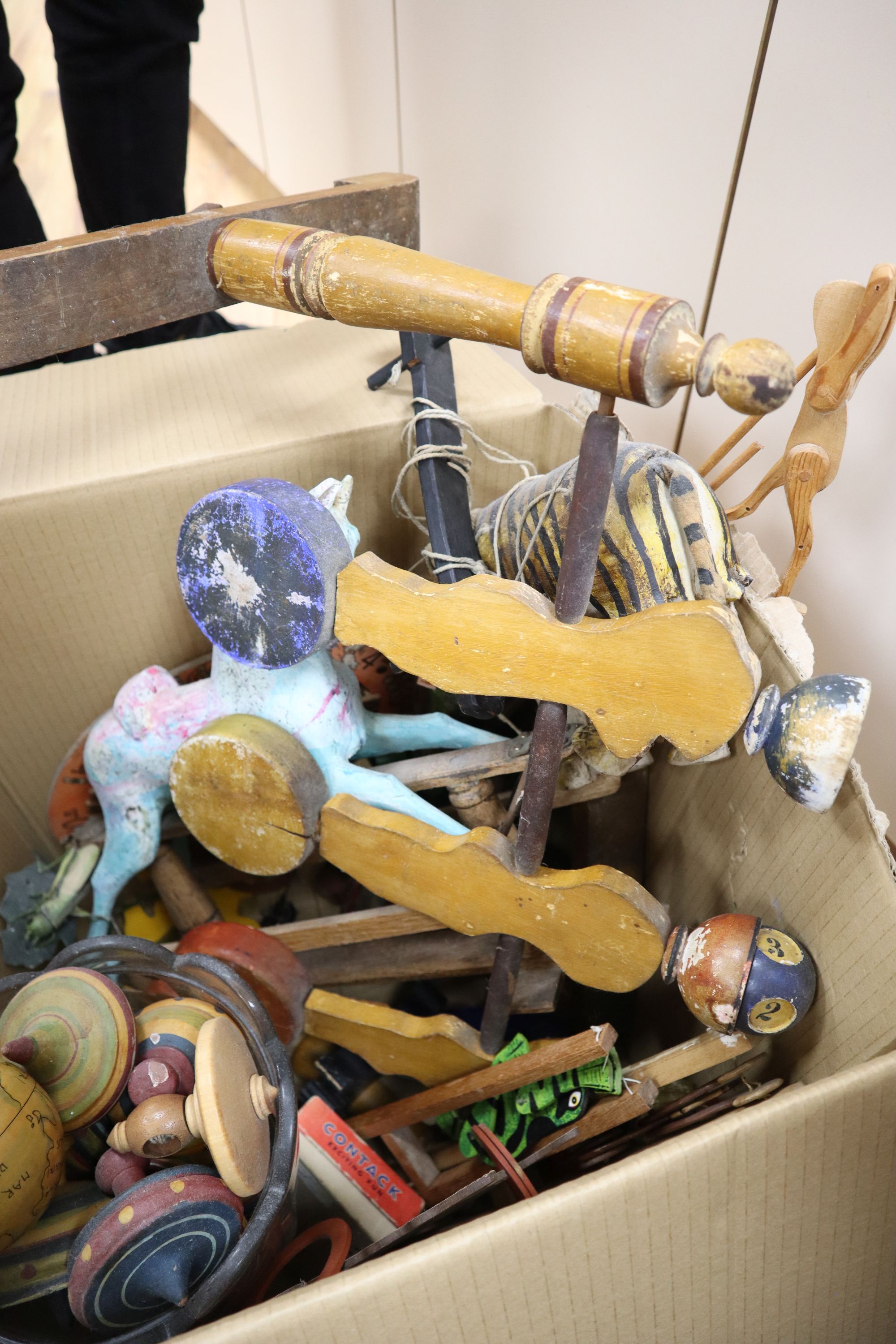 A Javanese tiger puppet, model wood rocking horse, a bowling game and quantity of mixed childrens toys games, late 19th/early 20th c